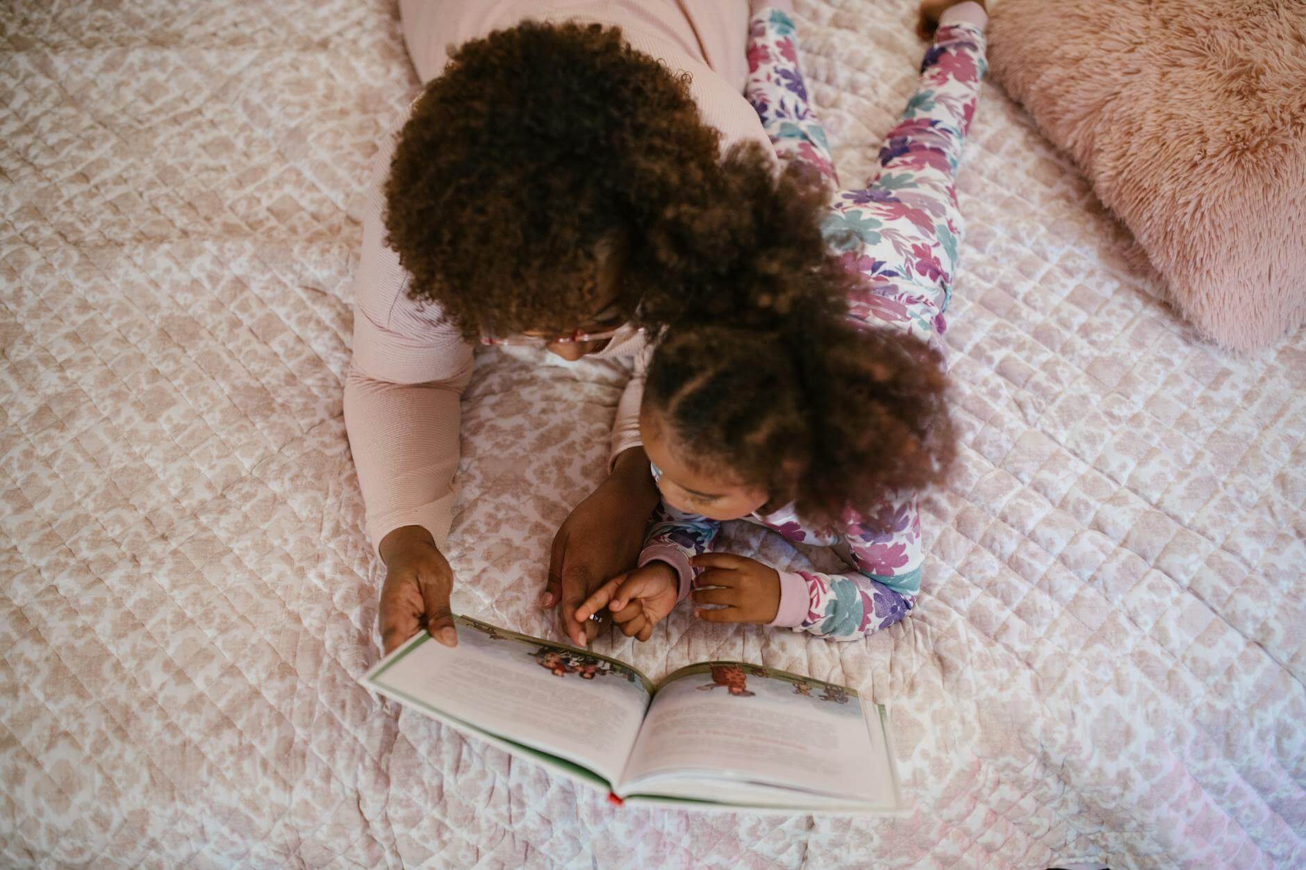 An image of mother and daughter reading book together. CurioBuddy encourages parents to create special bonds through reading its digital magazines and ignite curiosity.